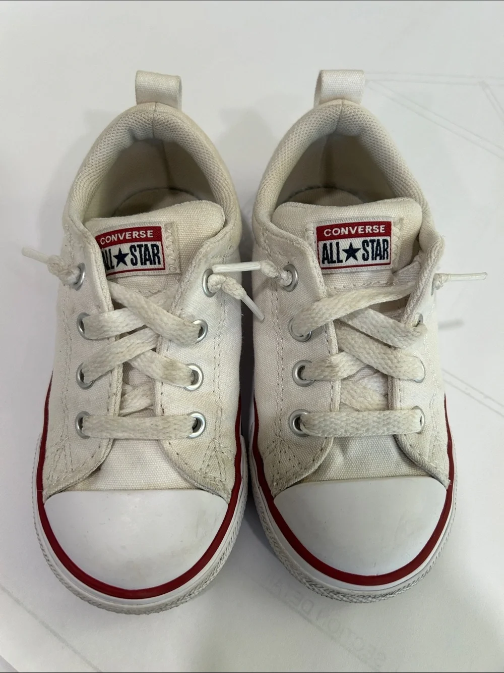 Converse Kids Low Top Canvas Sneakers in White and Red Trim
